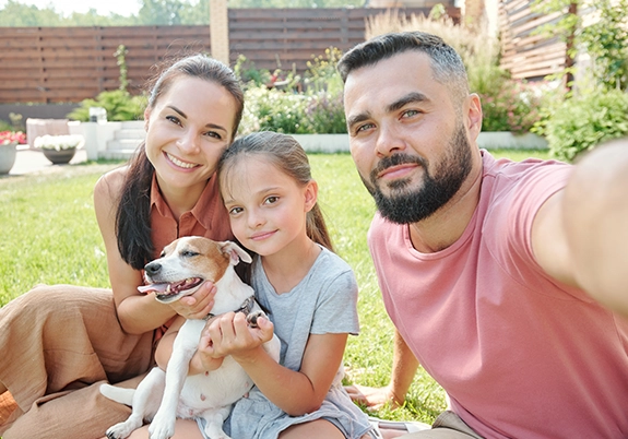 happy family with adopted dog